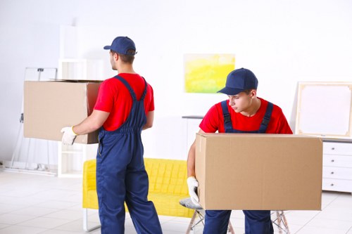Removal team preparing furniture with protective care during a Brixton move