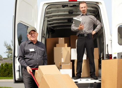 Office furniture and equipment being handled during a local move