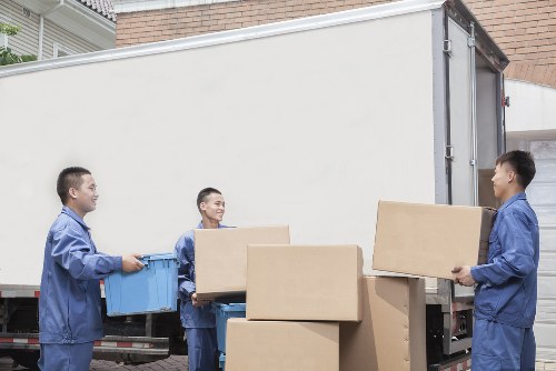 Removal team preparing a Brixton home move near a busy South London street