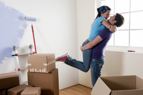 A well-organised home move with boxes, furniture, and packing materials
