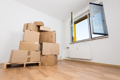 Brixton moving preparation checklist beside stacked moving boxes