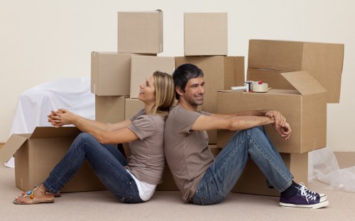Packing and loading household items into a removals van