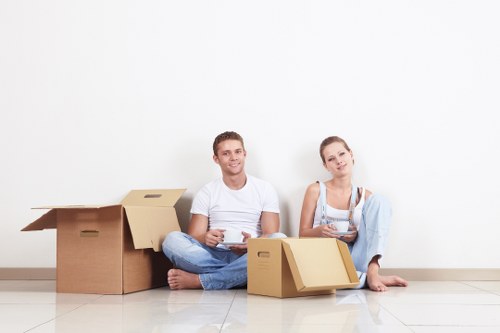 Local moving team handling boxes and furniture for a Brixton move