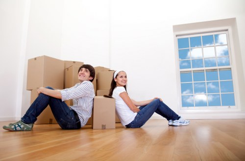 Packed moving boxes and furniture ready for a Brixton relocation