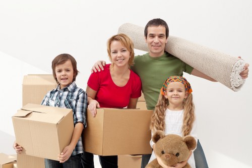 Professional movers handling boxes and furniture for a Brixton relocation