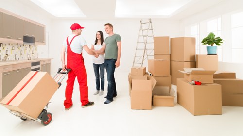 Packed office boxes and furniture ready for relocation
