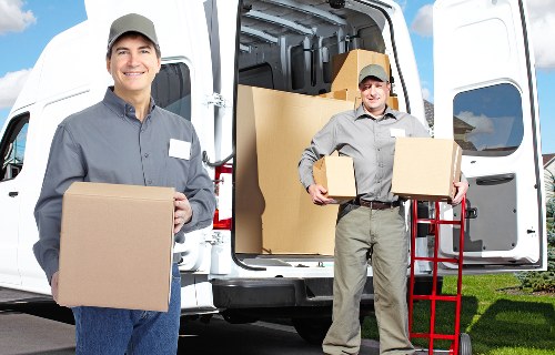 Local movers transporting office equipment in South London